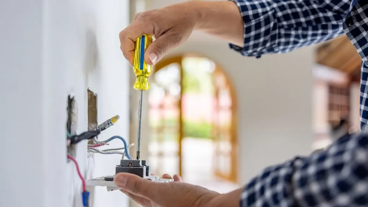 Tech repairing outlet indoors